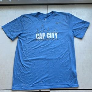 Soccer jersey with #21 on the back. Light blue and white